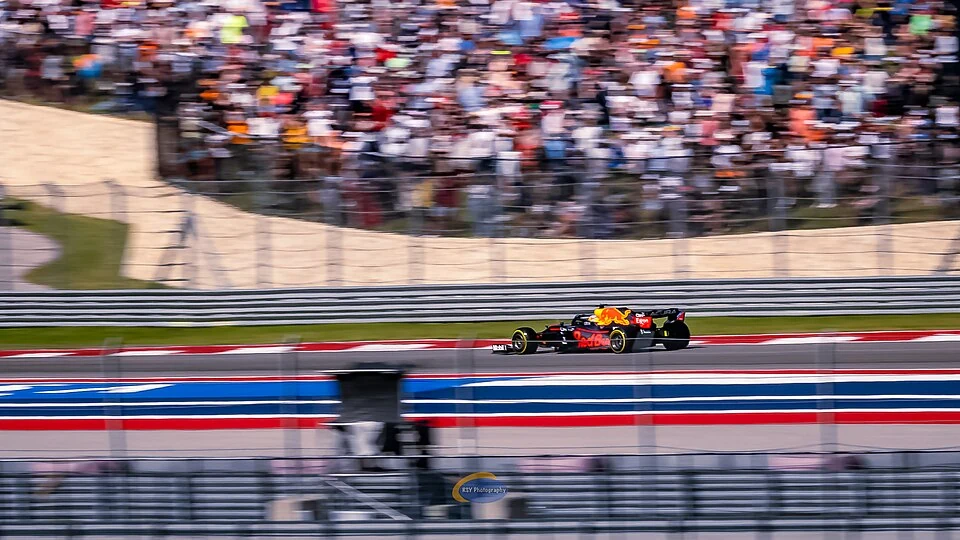 Formula 1 car racing past a packed crowd at Circuit of The Americas during the 2021 United States Grand Prix